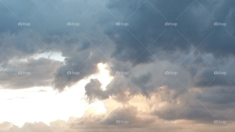 sunset through the clouds