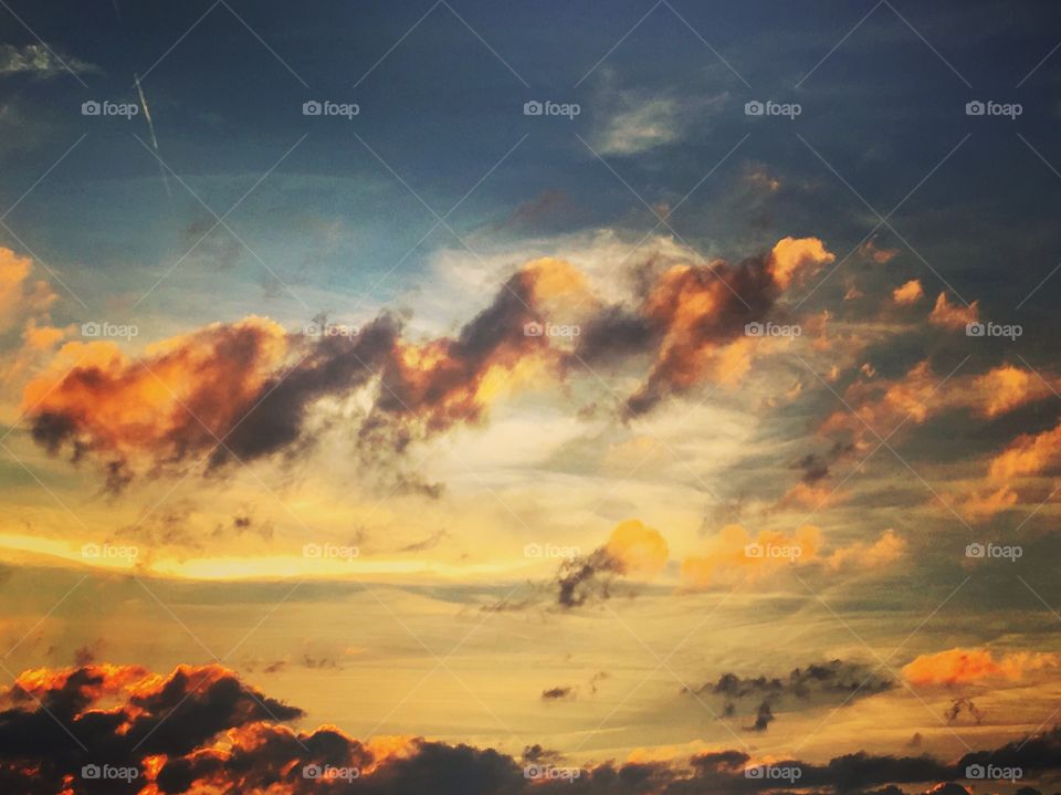 Low angle view of cloudy sky during sunset