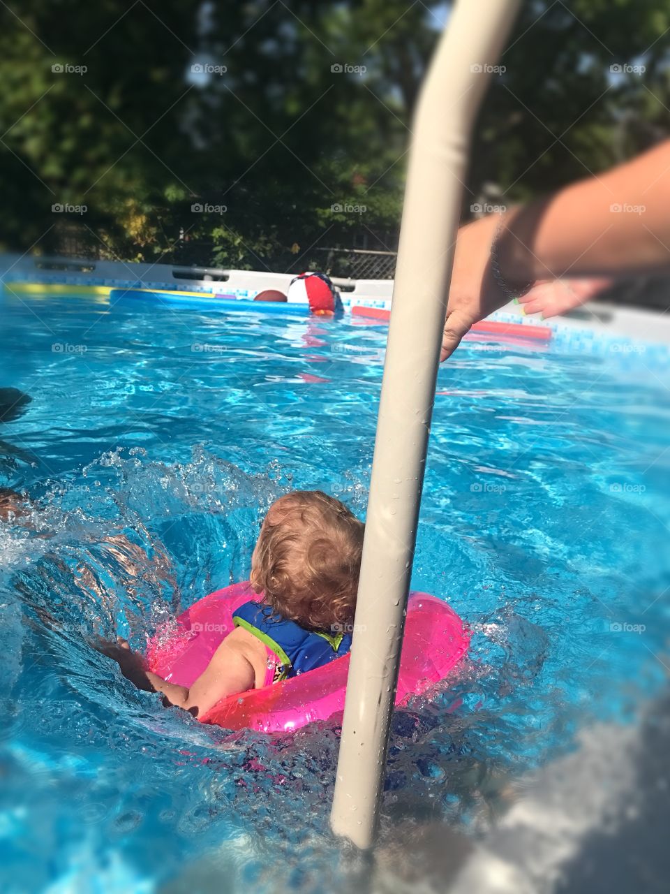 A fun day at the neighbors! This is my daughter being thrown into the pool