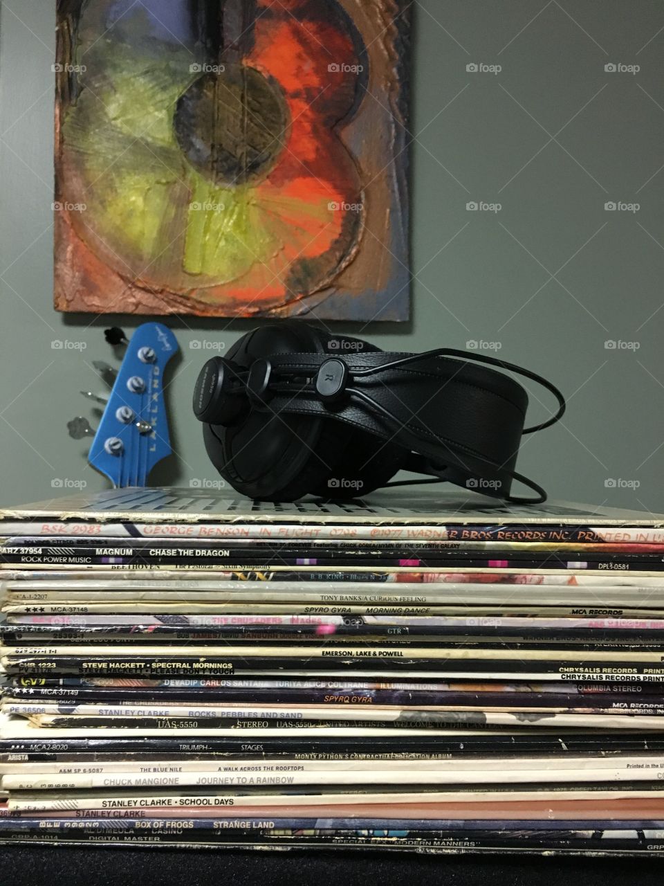 Vinyl; record albums in a stack with headphones in the studio
