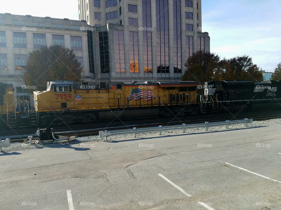 Union Pacific diesel engine running by the Wachovia Tower in downtown Roanoke Virginia