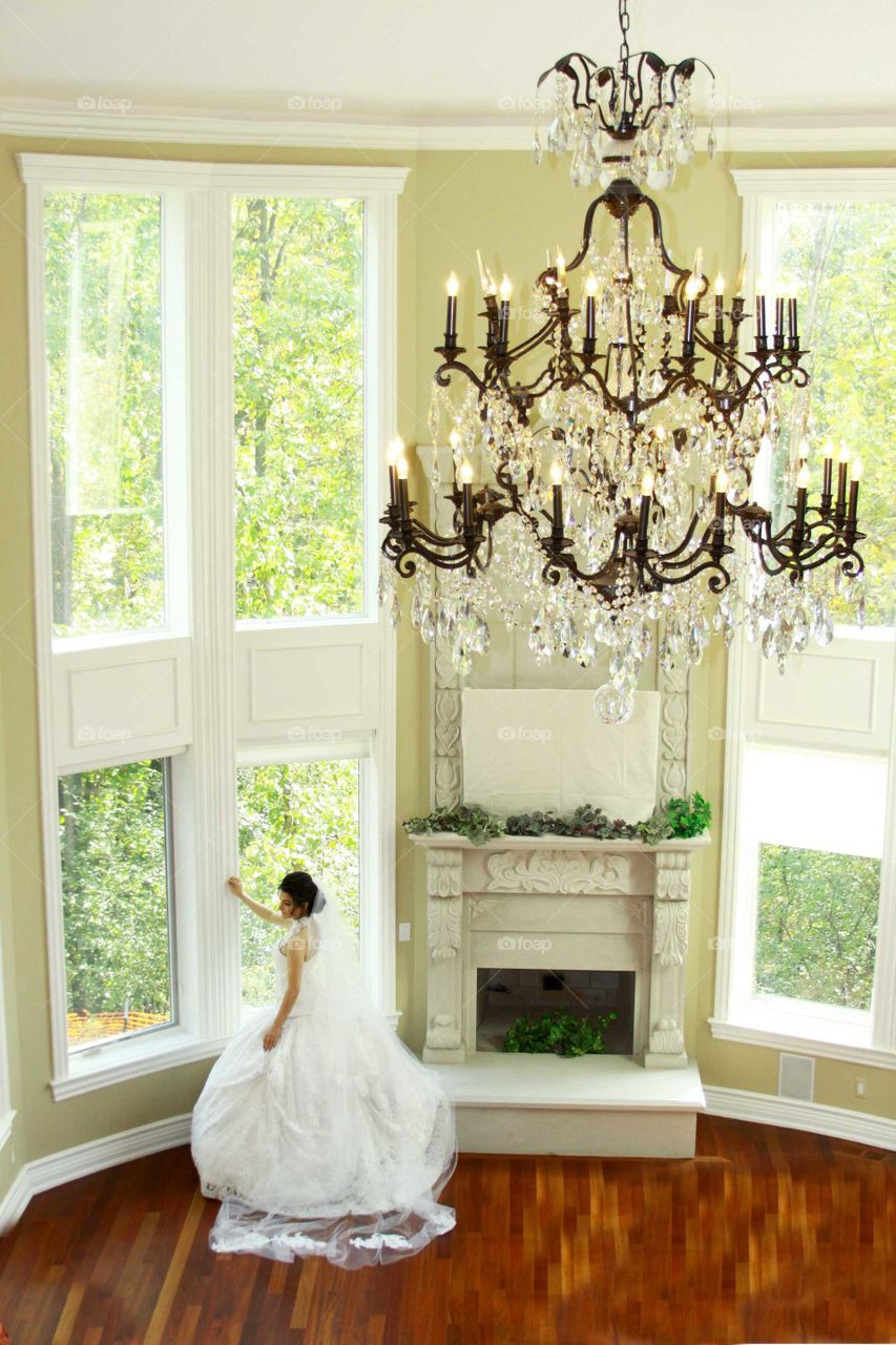 Elevated view of a bride standing near window