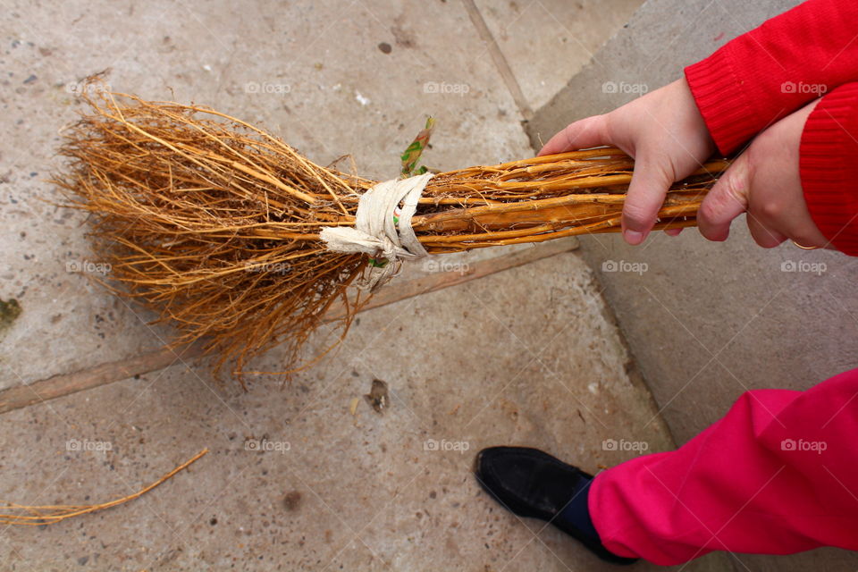 Broomstick and a red pullover girl