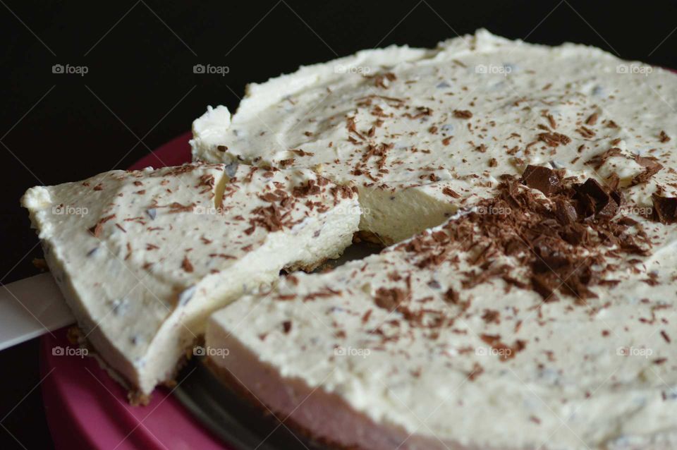 homemade cold cheesecake with grated chocolate