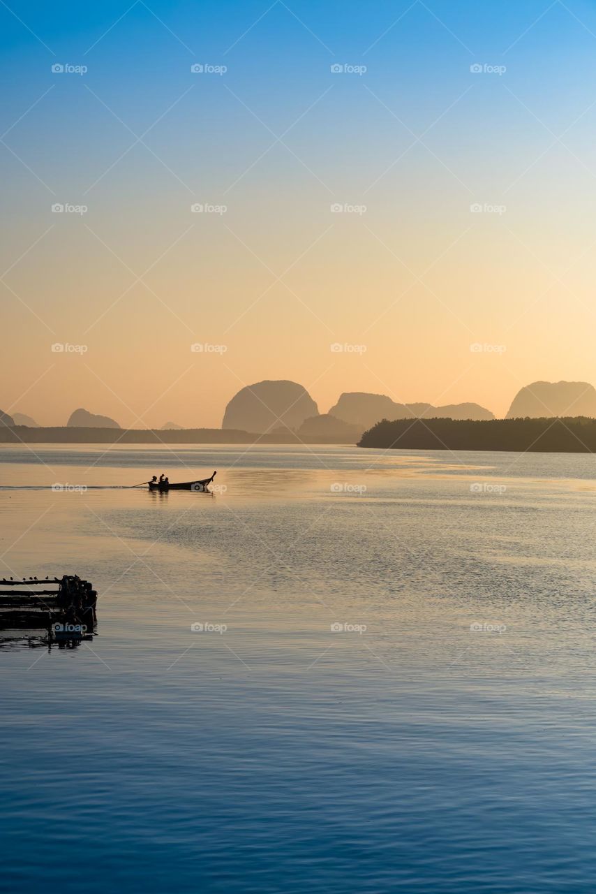 Contrast shade of orange and blue color in morning scene of sea scape