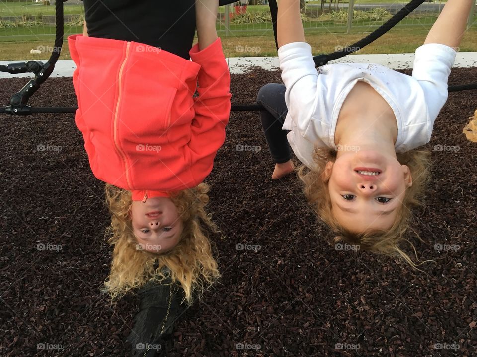 Hanging upside down at the park.