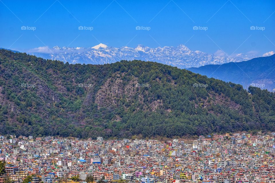 Part of kathmandu city with hills and mountains at background 