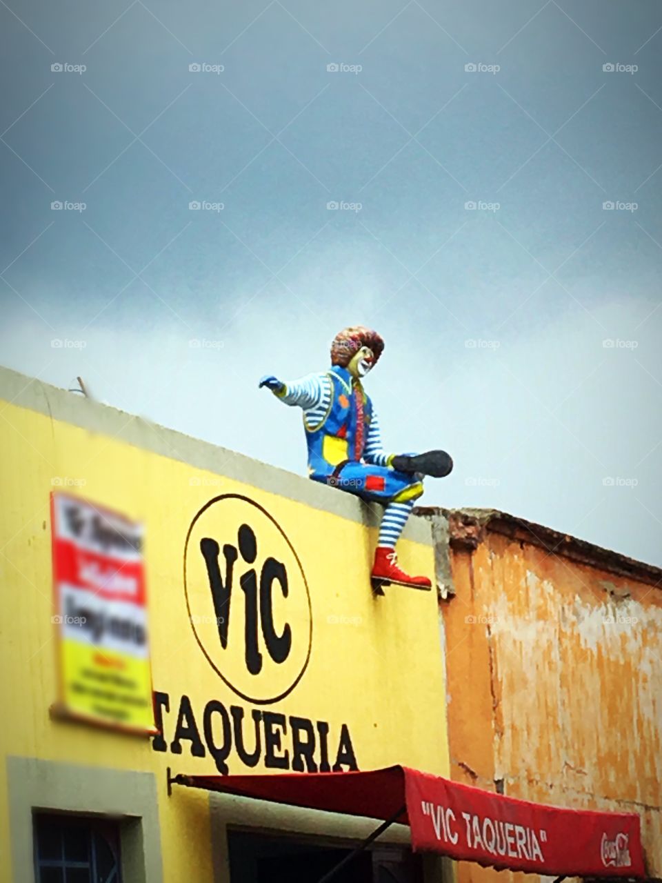 McDonald's in top of a taco restaurant 