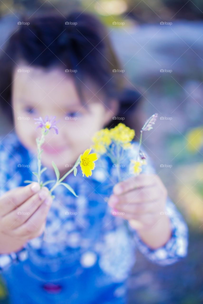 Little Girl with Yellow Flowers