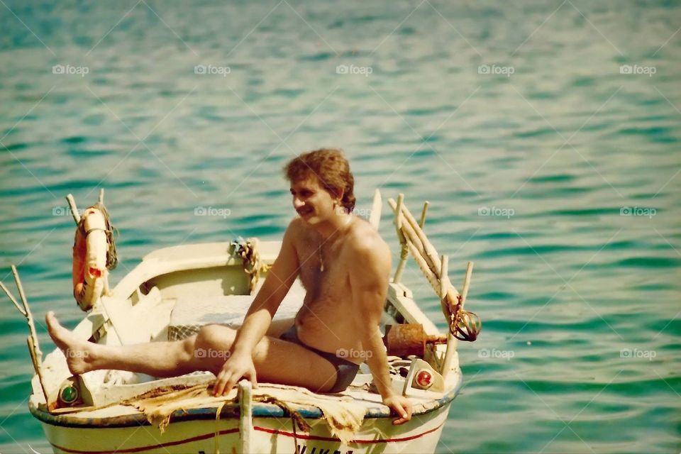 Chris and the boat. My dad 30 years becore! I love this photo cause the boat has my name on it.. 