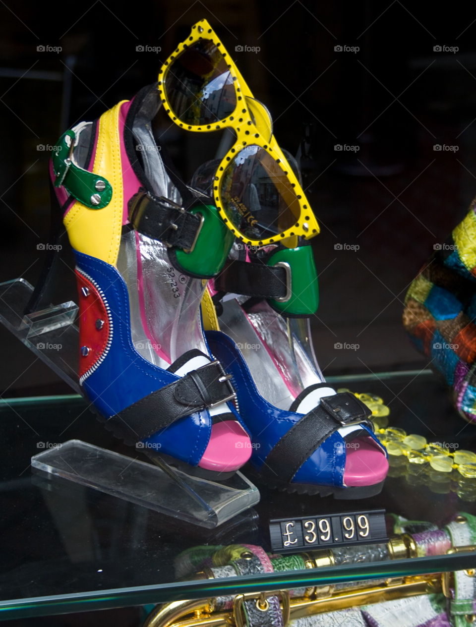 Brightly coloured shades and shoes shop window display in Hastings Old Town