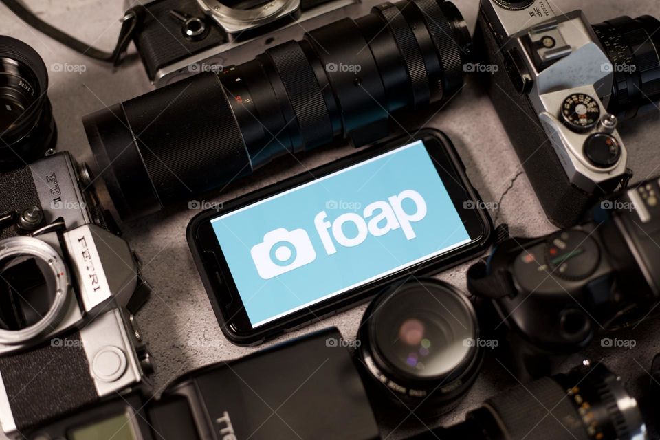 Foap symbol among flash, lens, and camera bodies