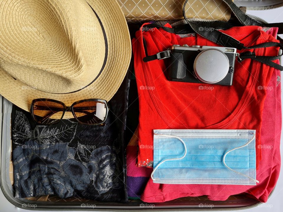 open suitcase photographed from above ready for the holidays