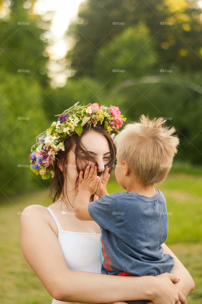 Todller boy and his aunt. Celebrating midsummer.