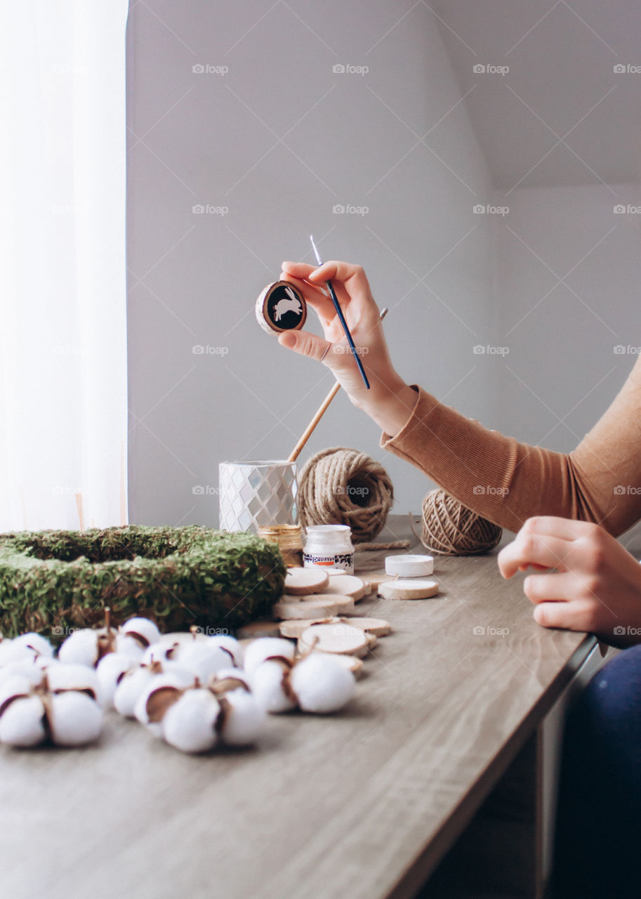 photo of a woman crafting an Easter wreath made only from eco friendly materials