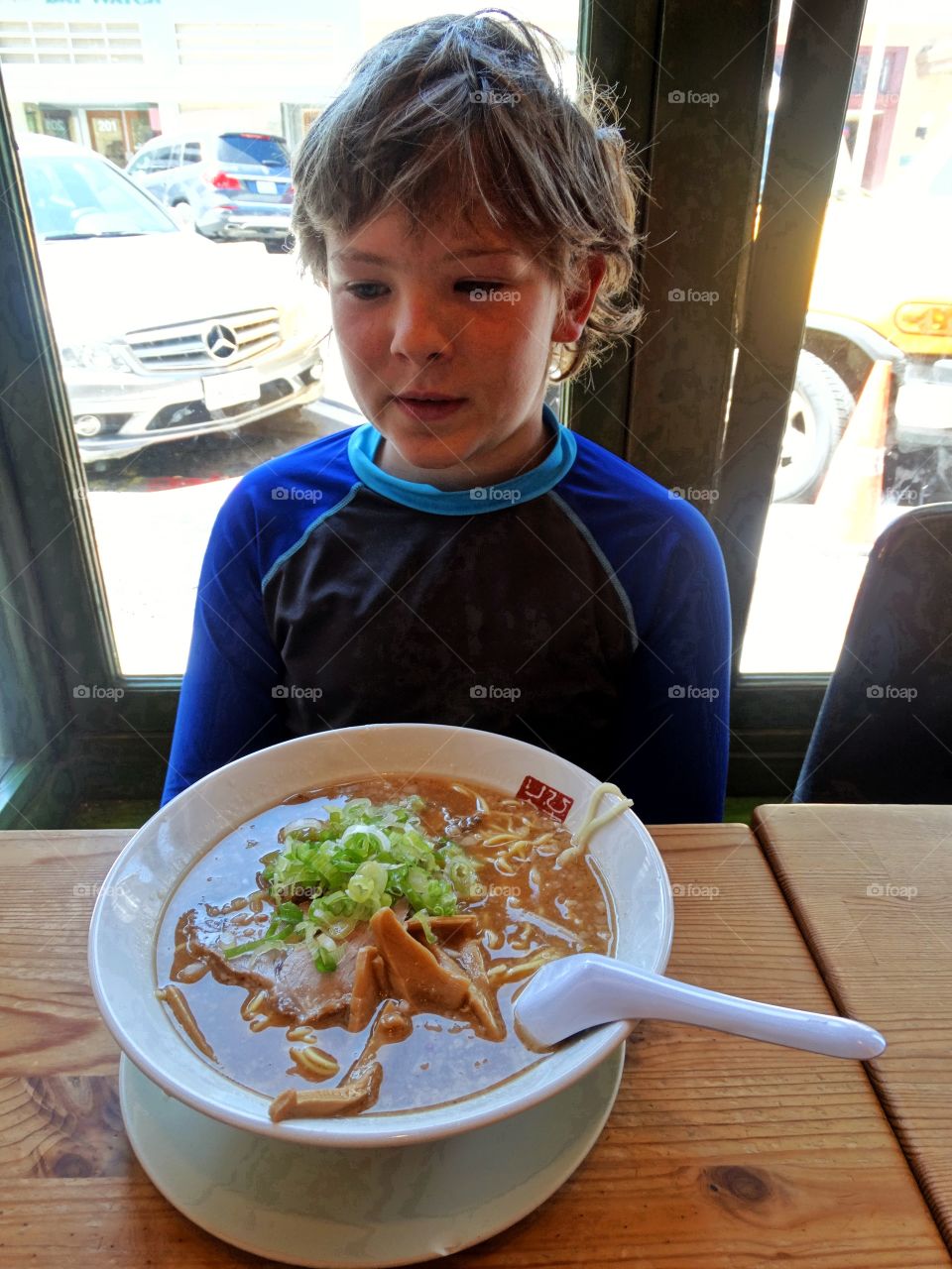 Boy Eating Ramen Noodle Soup
