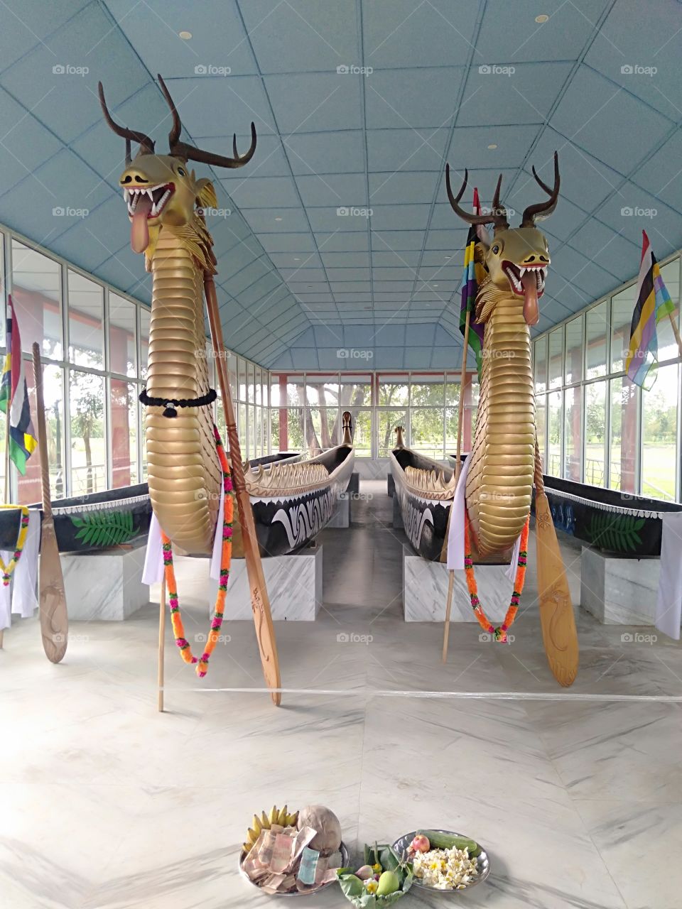 Two  big boats used by the royal families and two small boats used by the common people at Kangla, an ancient palace of the Meitei Kingdom, a tourist destination, in the heart of Imphal City, the capital of Manipur, a state in India.