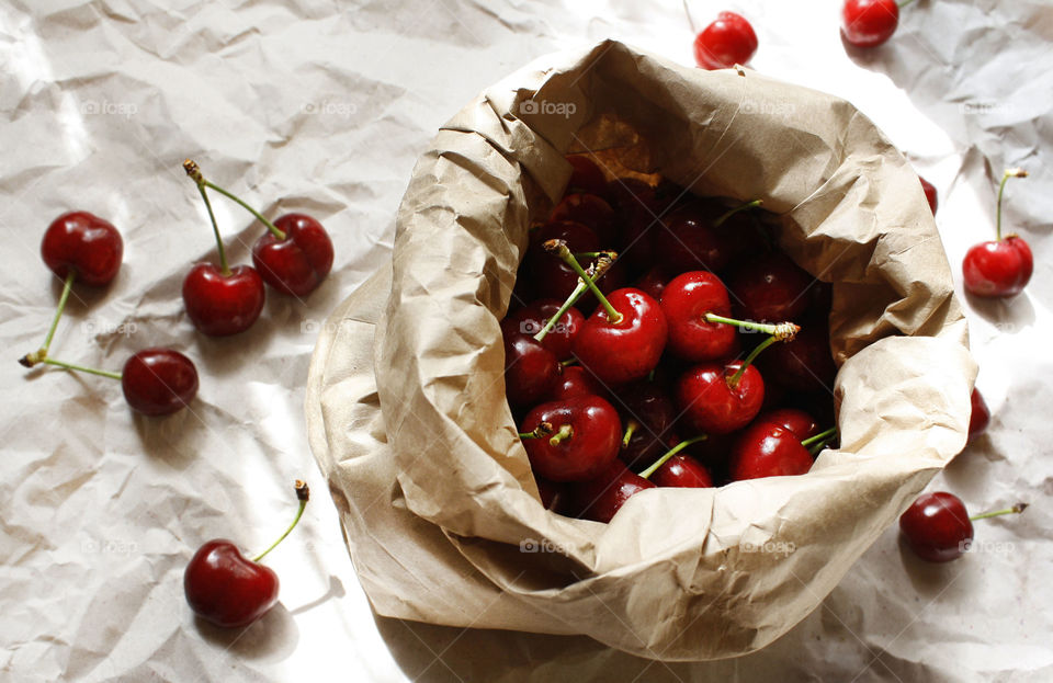 Healthy food, cherries in a paper bag