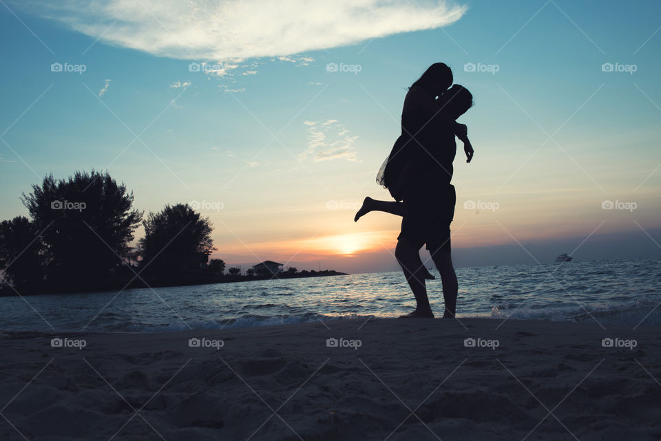 Silhouette of couple on beach