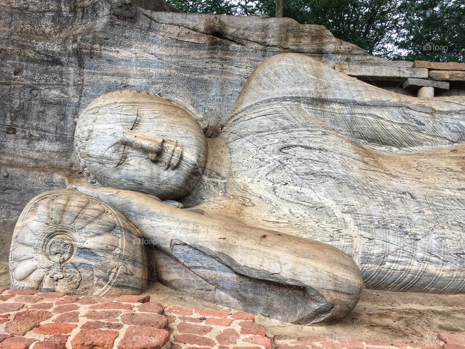 Ancient stone Buddha statues in Gal Viharaya Buddhist temple Polonnaruwa 