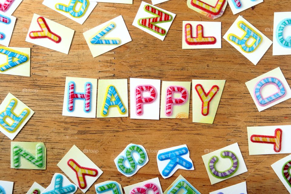 word happy in colorful letters. word happy spelled in colorful letters