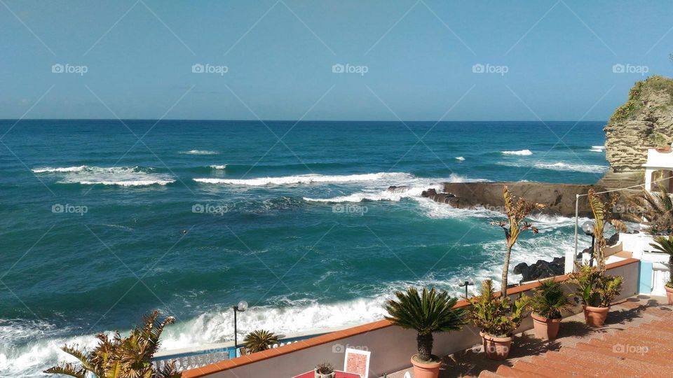 The waves of the Mediterranean Sea in Citara Bay on the Italian island of Ischia