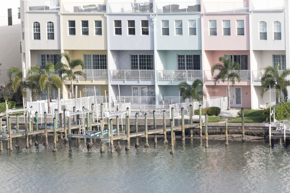 Moden pastel colored houses by the water 