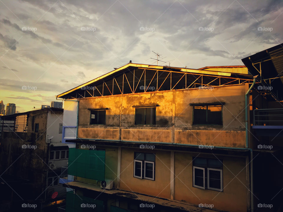 Beautiful light of sunset fallen on to vintage house , Bangkok, Thailand