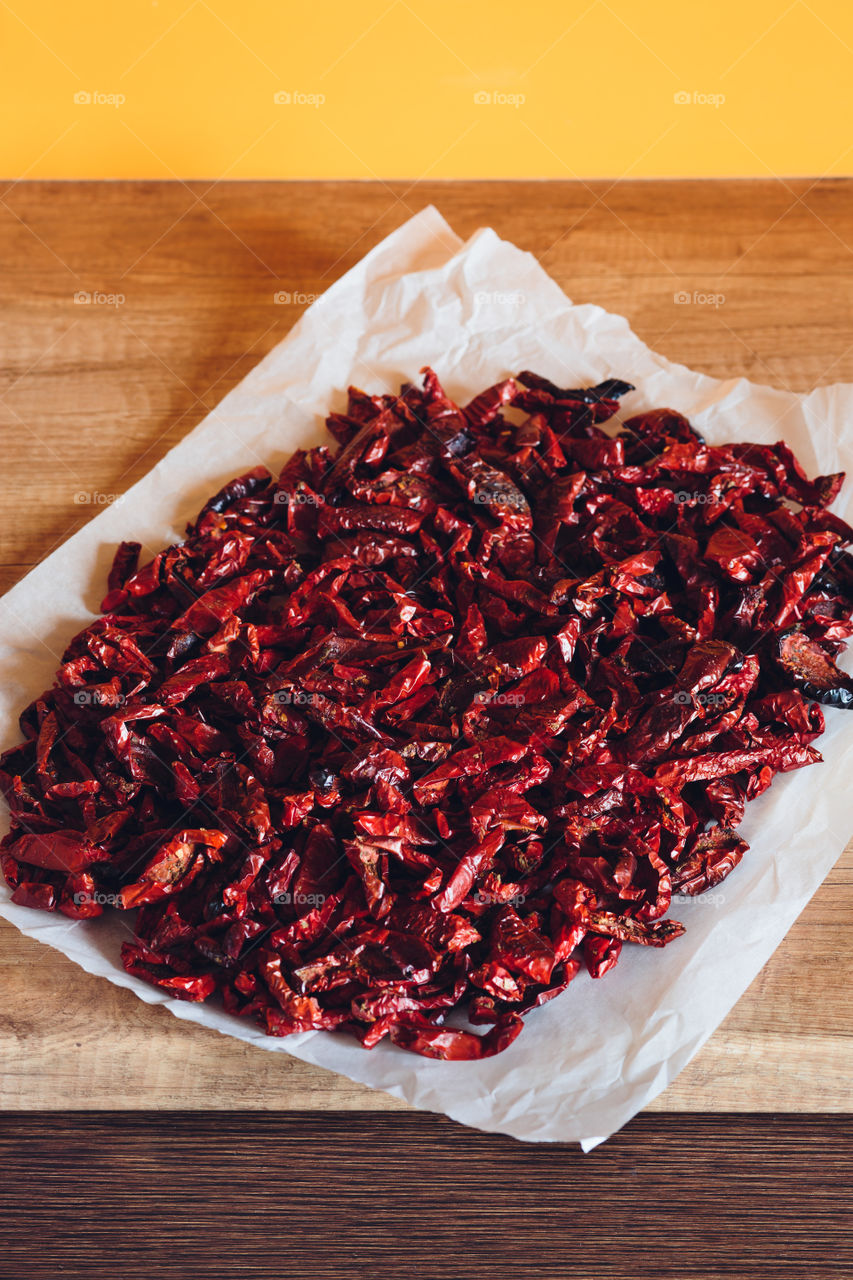 Dried tomatoes. Dried tomatoes on baking parchment paper