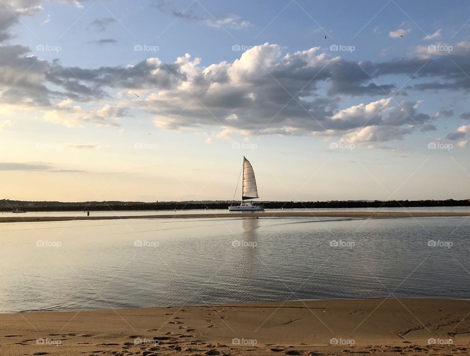 Sailboat on the ocean at low tide
