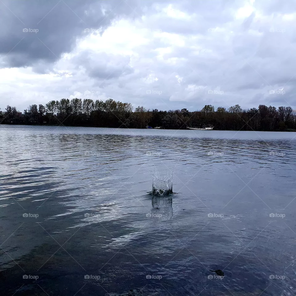 Stone makes a splash in water.
