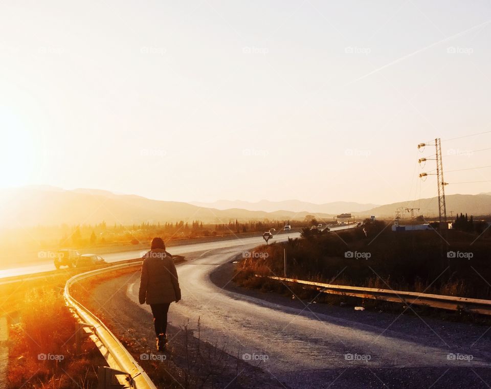 girl in a road golden hour