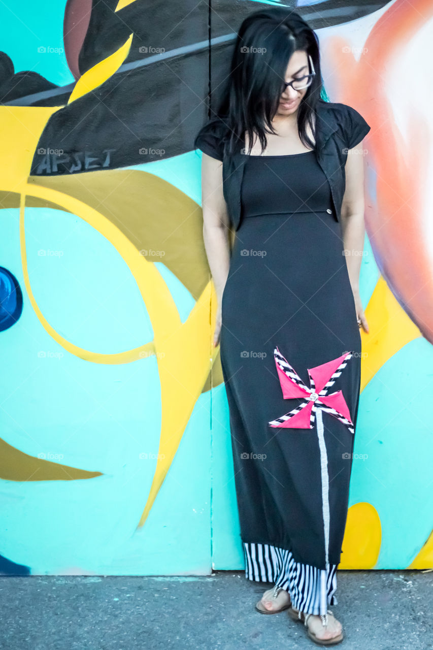 Young Woman In Front Of Graffiti Wall
