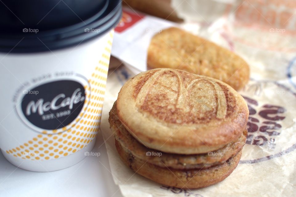McDonald’s Mc Café sausage McGriddle hash brown close up side flat lay