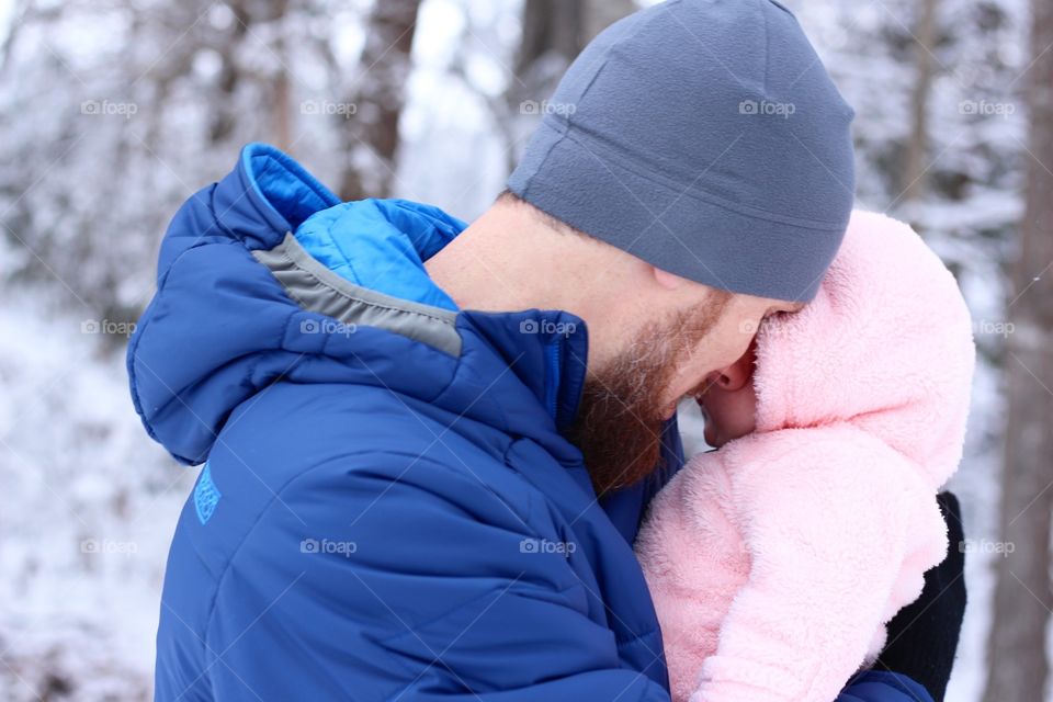 Daddy and daughter in the snow