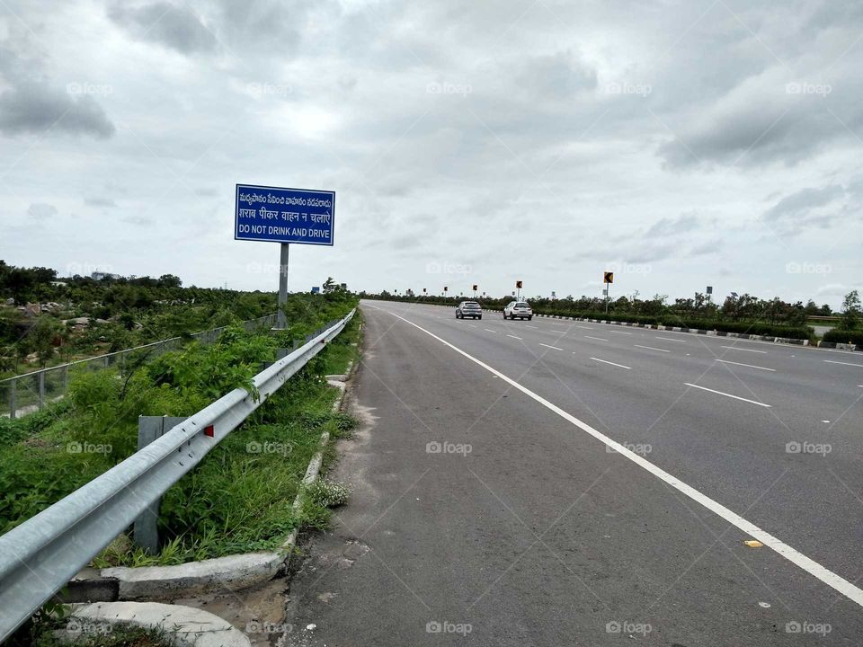 a sign board on the highway