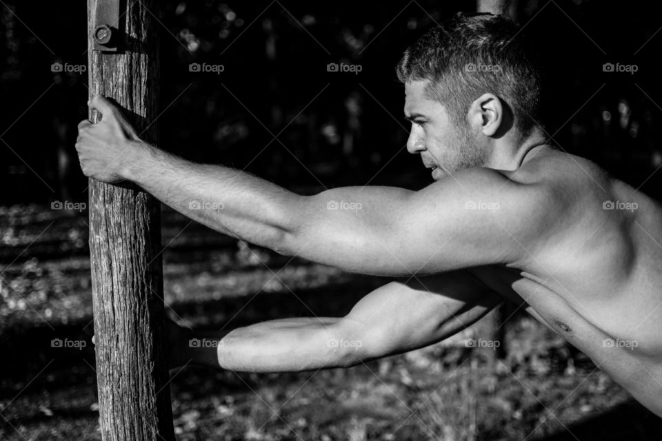 Close-up of a muscular man stretching