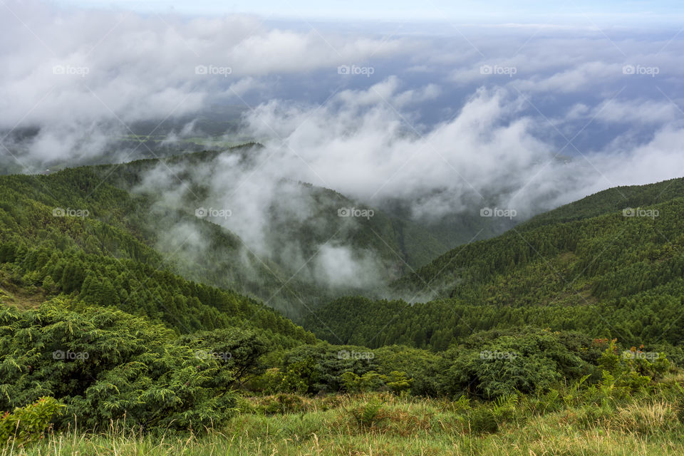 Hiking on Pico da Vara the highest mountain of Sao Miguel island, Azores, Portugal. A cloudy day.