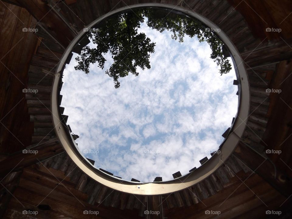 Sky View. A beautiful summer sky through a treehouse ceiling