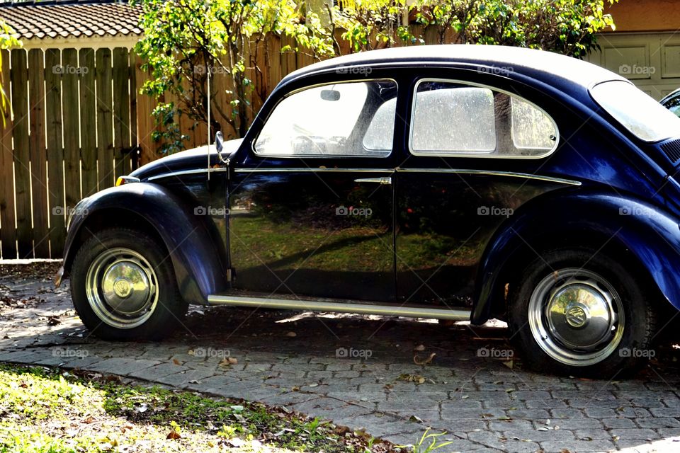 black VW beetle. dirty windows but beautiful shine on a black VW Bug
