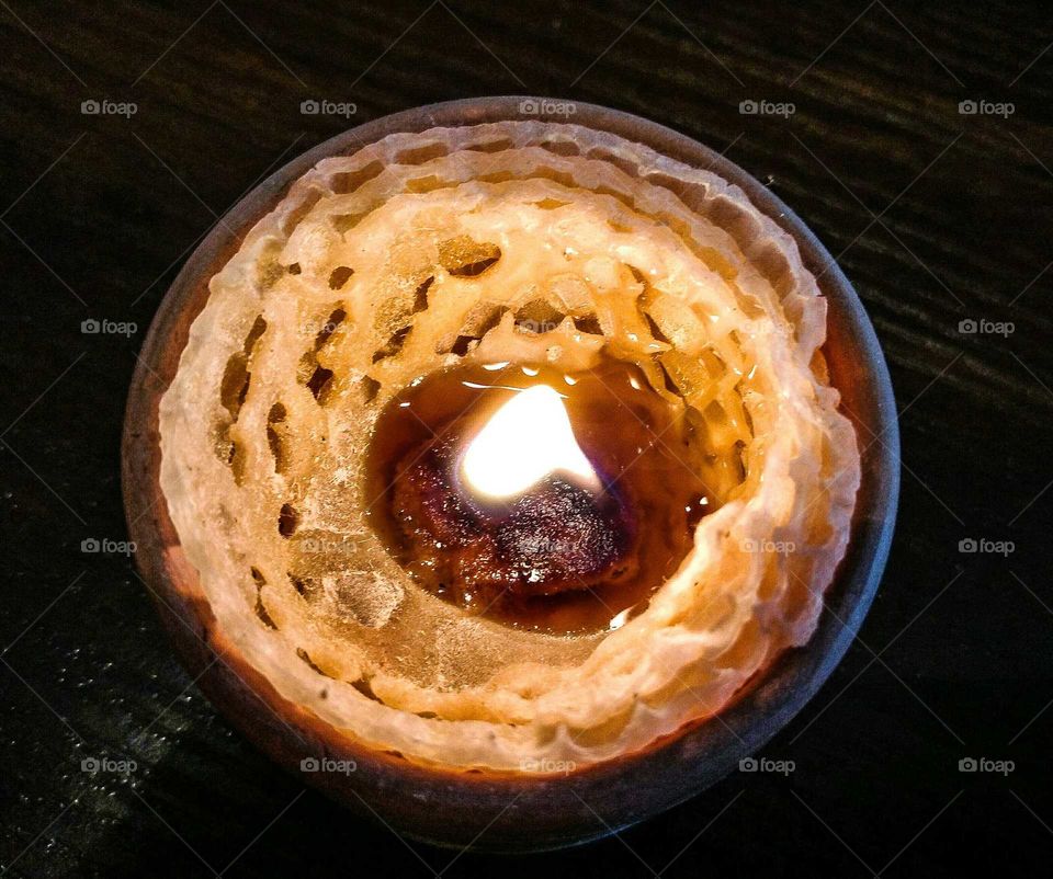 Elevated view of burning candle
