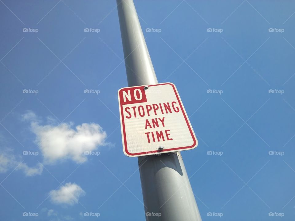 No stopping any time sign.