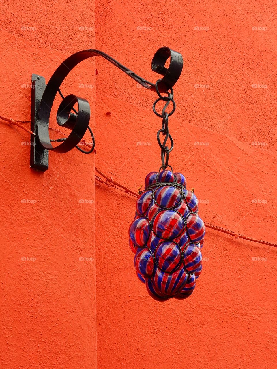 Murano glass lamp on orange wall