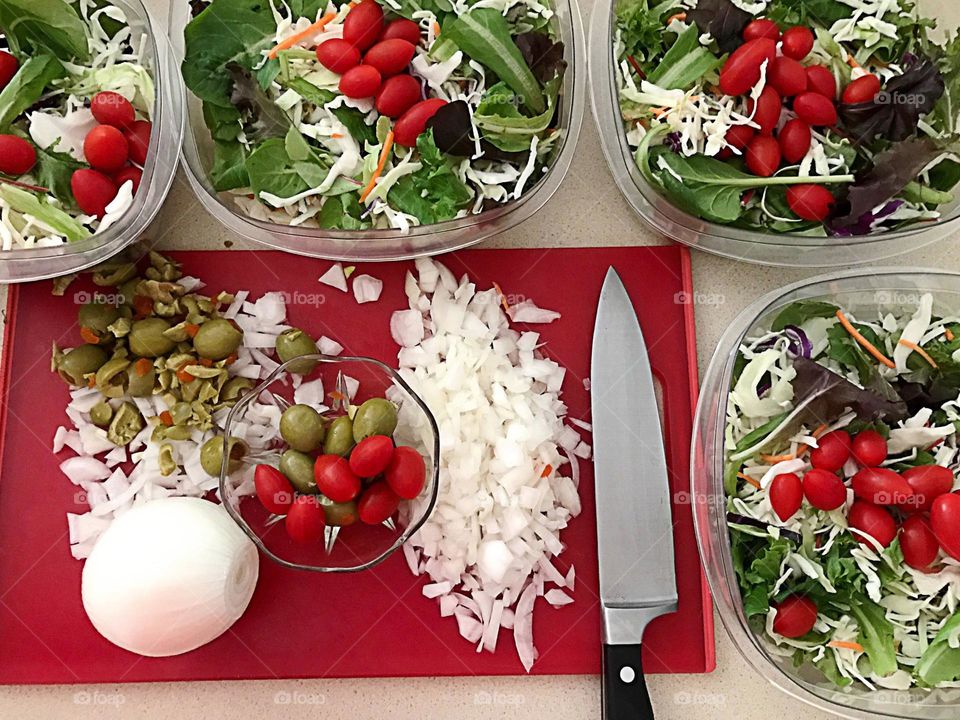 Preparing vegetables for meals and salads.
