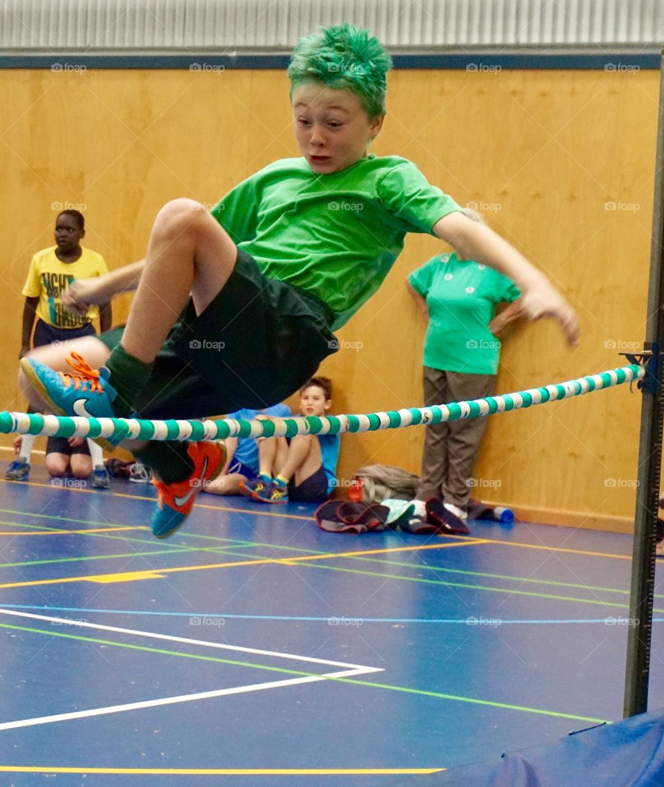 High jump. Boy attempting the Fosbury flop high jumpat a school sports day
