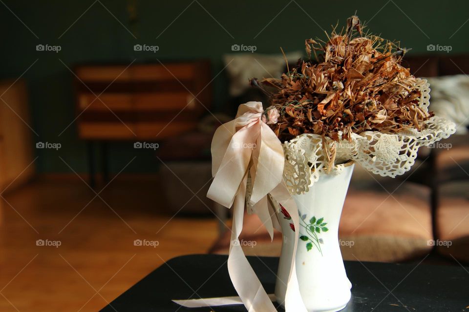 Close up of flowers in a vase in living room