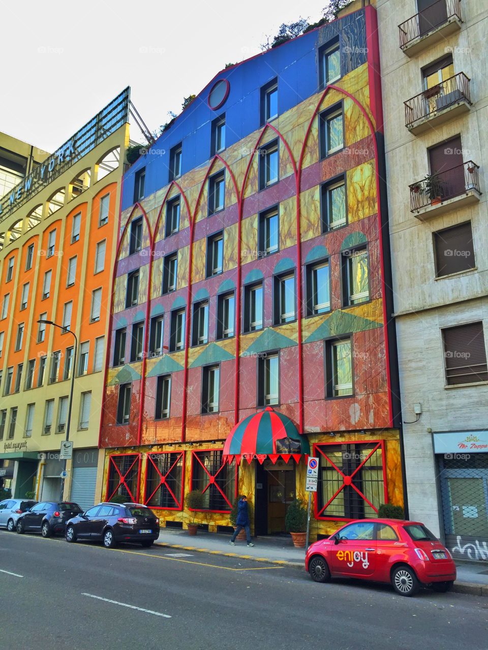 A colorful building beside the street 