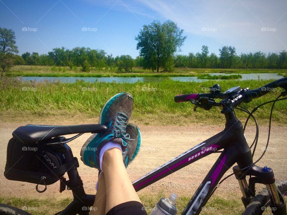 Enjoying a well deserved rest from bike riding through Fish Creek Park, Calgary, Alberta