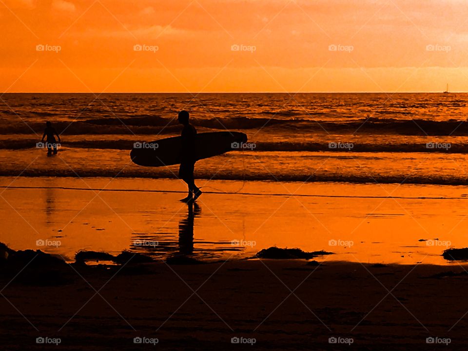 Surfing at sunset 