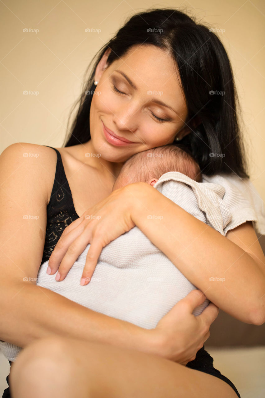 Portrait of mother loving her baby